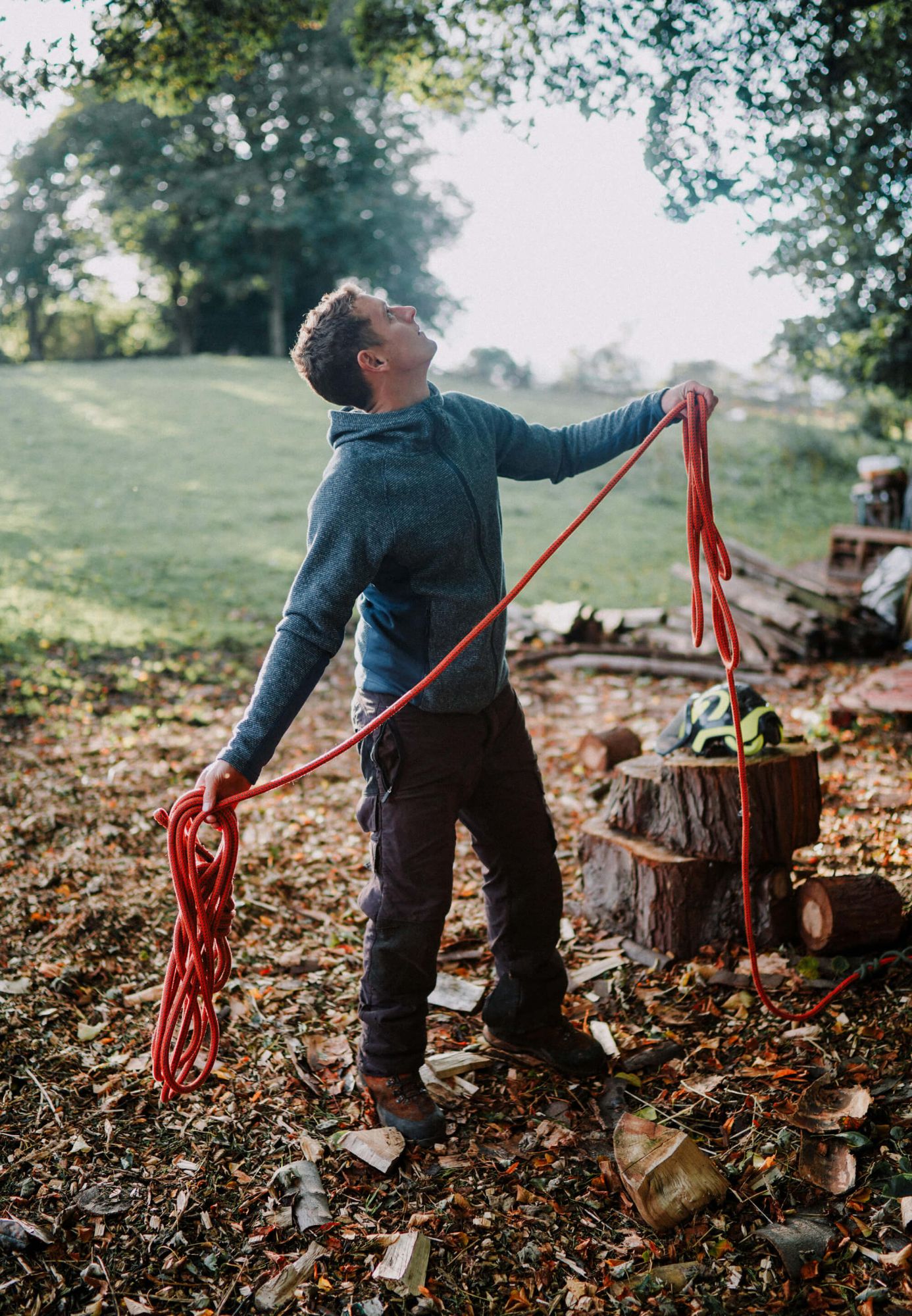 A photo of a Tree Surgeon Sheffield throwing a rope into the tree to start climbing